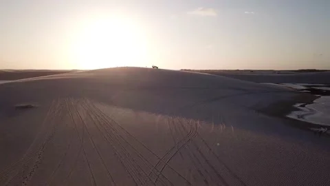 Guy walking alone in dunes of Lencois Maranhenses Video stock 168403490