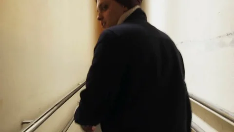 Guy is walking along the corridor Stock Footage