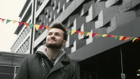 The guy is walking around the city 스톡 동영상 128919231