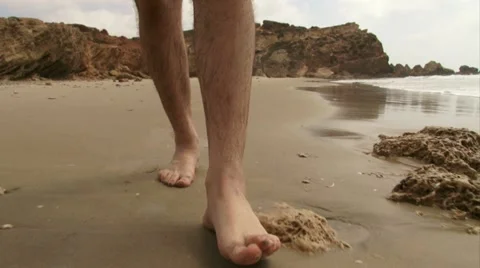 Guy walking on the beach Stock Footage 20507258