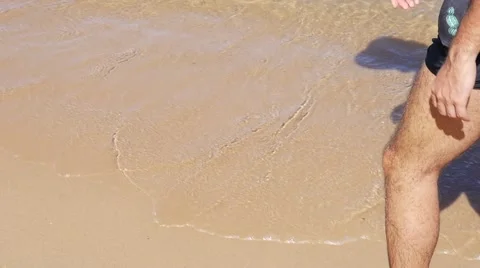 Guy walking on beach Stock Footage 62839526