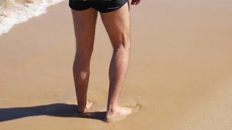 Guy walking on beach Stock Footage 62839802