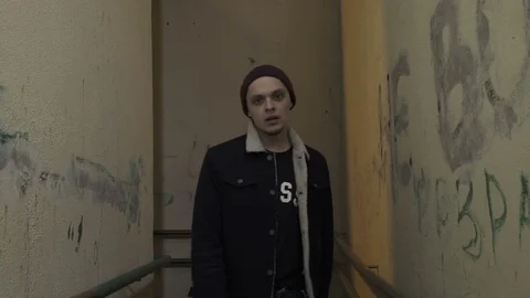 Guy is walking down the hallway Stock Footage