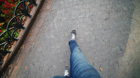 Guy walking down the street of autumn city Stock Footage 32167609