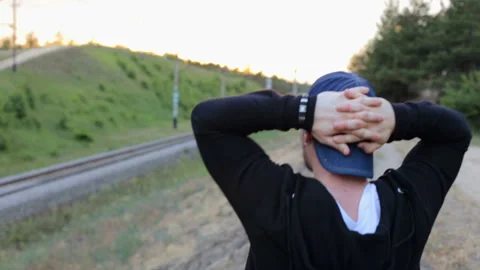 Guy walking in the park Video stock 100966543