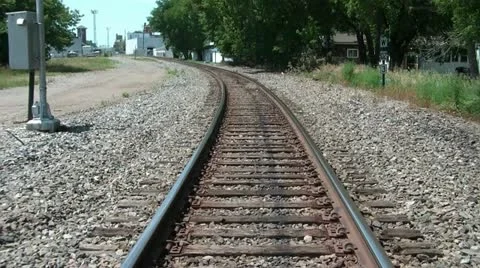 Guy Walking on Railroad Tracks Stock Footage 12587666