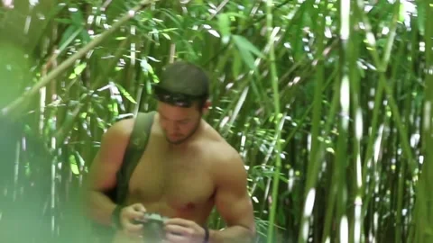 Guy walking through bambu forest Stock Footage 166805472