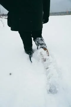 Guy walking through deep snow Stock Photos
