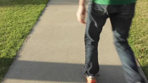 Guy Walking Through Park with Coffee Stock Footage 134738708