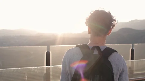 A Guy Walking Toward The Sunset 스톡 동영상 119810699