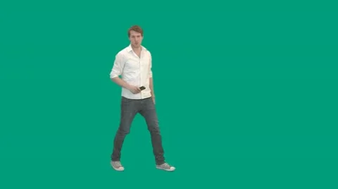 Guy walks in and uses remote control - green screen - pre keyed - MINT.GS Stock-Footage 11344222