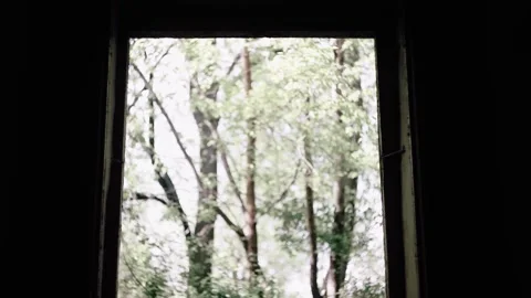 A guy walks into a dangerous old house wearing a hard hat. The unknown is ahead. Stock Footage 131877737