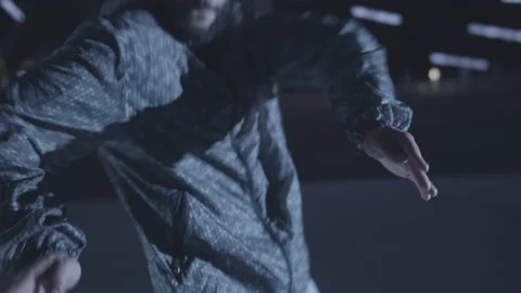 Guy Walks Into The Light At Night Stock Footage 217582893