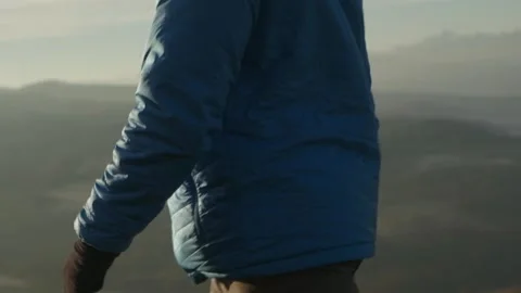 A guy walks in the mountains, a man walks in the highlands Stock Footage 171636595