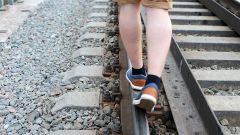 The guy walks on rails Stock Footage 90162092