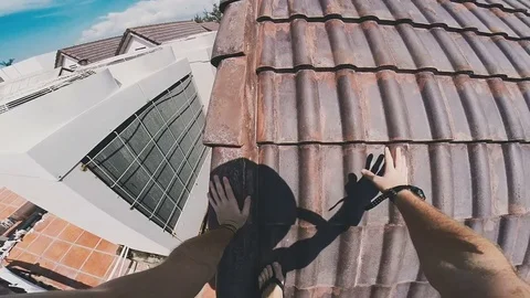 Guy walks on the roof Stock Footage 80533643