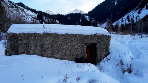 A guy walks into a stone hut in the mountains Video stock 232774441
