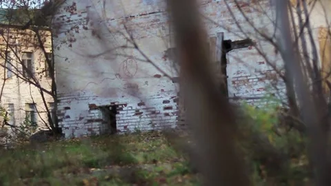 Guy walks through an abandoned building Stock Footage 130739403