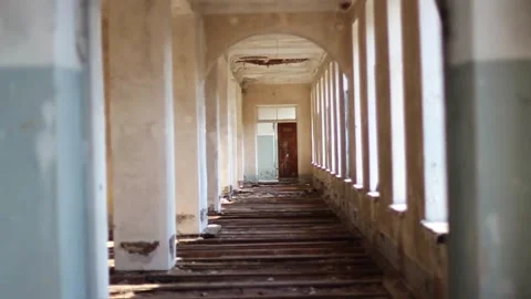 Guy walks through an abandoned building Stock Footage 130739901