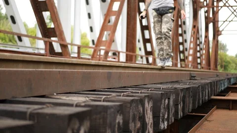 The guy walks on top of the mountain and eats an Apple Stock Footage 113680006