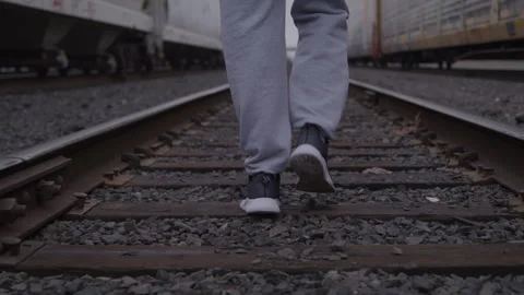 Guy Walks On Train Tracks In Sneakers Stock Footage 270325540