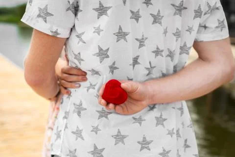 The guy wants to make an extension of his hand and heart to his beloved girlf Stock Photos