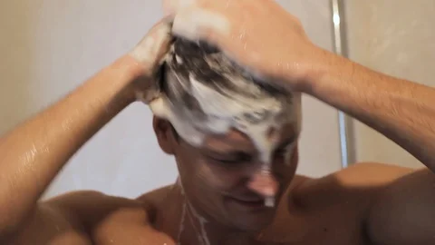 Guy is washing in the shower Stock Footage 86364567