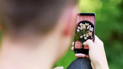 A guy watches a video about how I prepare delicious food. Stock Footage 201824466