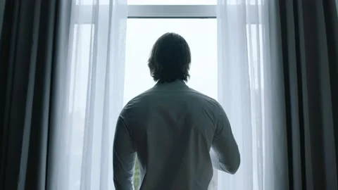 Guy Watching Something Outside Video stock 196719053