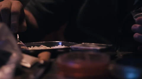 Guy weighing Cocaine on the table Stock Footage 275104936