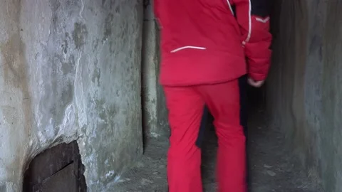 The guy went into the corridor of the old prison Stock-Footage 233057535