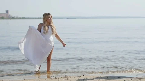 Guy in White Clothes is Trying to Stand up Stock Footage 88031263