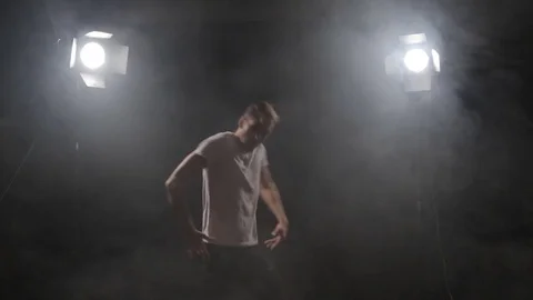 A guy in a white poppy dancing Stock-Footage 80834386