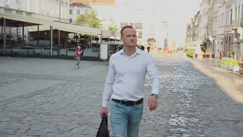 A guy in a white shirt walks through the ancient city Video stock 160126909
