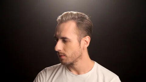 The guy in the white shirt wearing a hat Stock Footage 80653645