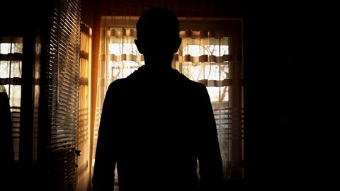 The guy at the window stretches after sleep Stock Footage 127361759