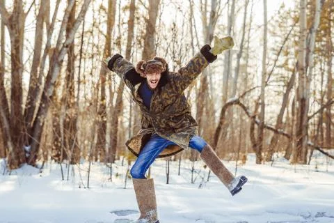 Guy in the winter jump in the woods Stock Photos