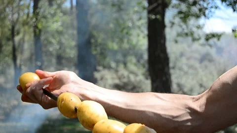 The guy in the woods to roast the potatoes Stock Footage 120832287