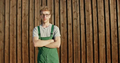 Guy working builder architect in work uniform overalls European appearance Stock Footage 142256925