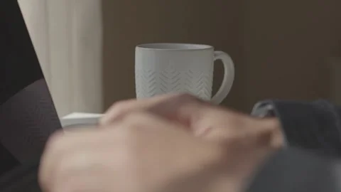 Guy working on laptop and drinking coffee Stock Footage 151469748