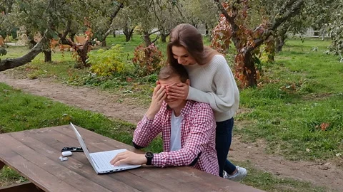 Guy working on laptop in the park Stock Footage 220956488