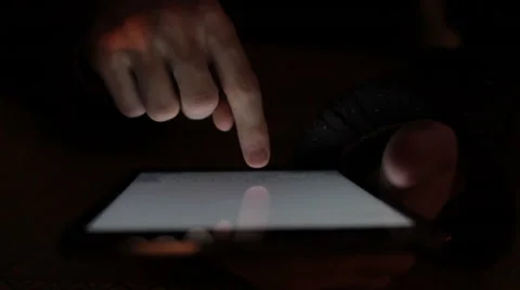 A guy working on a tablet with one hand Video stock 47770822