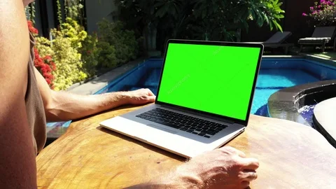 Guy Working on Vacation Reading Something Interesting Green Screen Stock Footage 119808171
