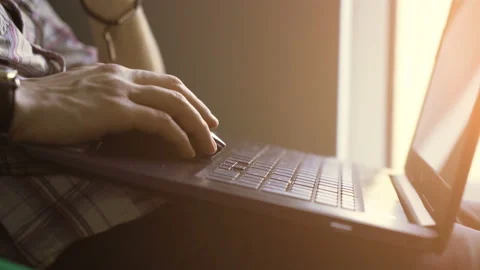 The guy works at the laptop. close-up Stock Footage 104552704