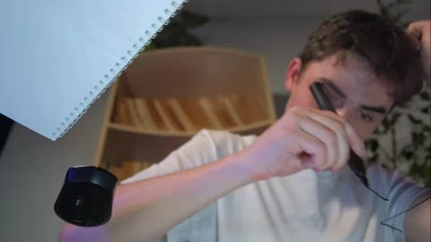 A guy works at a transparent desk in an office Stock Footage 264887098