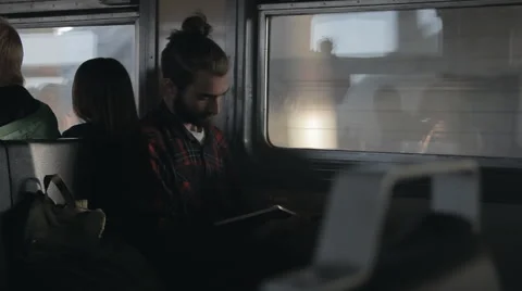 The guy write in notebook in the train Stockbeeldmateriaal 65219705