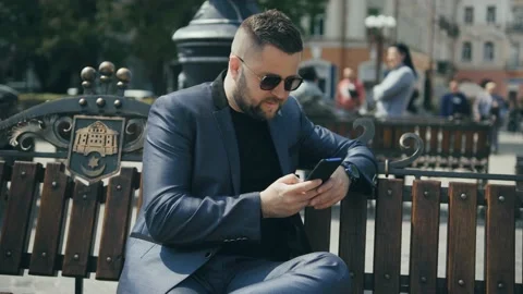 The guy writes a text message with both hands Stock Footage 172503218