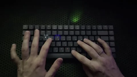 The guy writes the word "internet" on a glowing keyboard Stock Footage 242395502