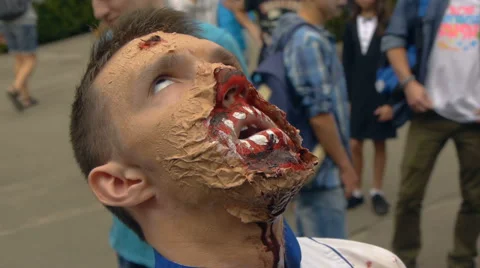Guy zombie staring at the sky and rolls his eyes, Halloween Stock Footage 68209393