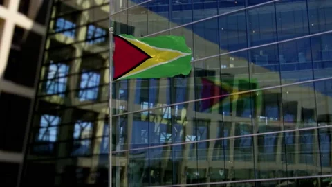 Guyana Flag Waving On A Skyscraper Building Video stock 146132528